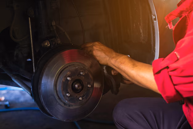midsection-mechanic-repairing-car